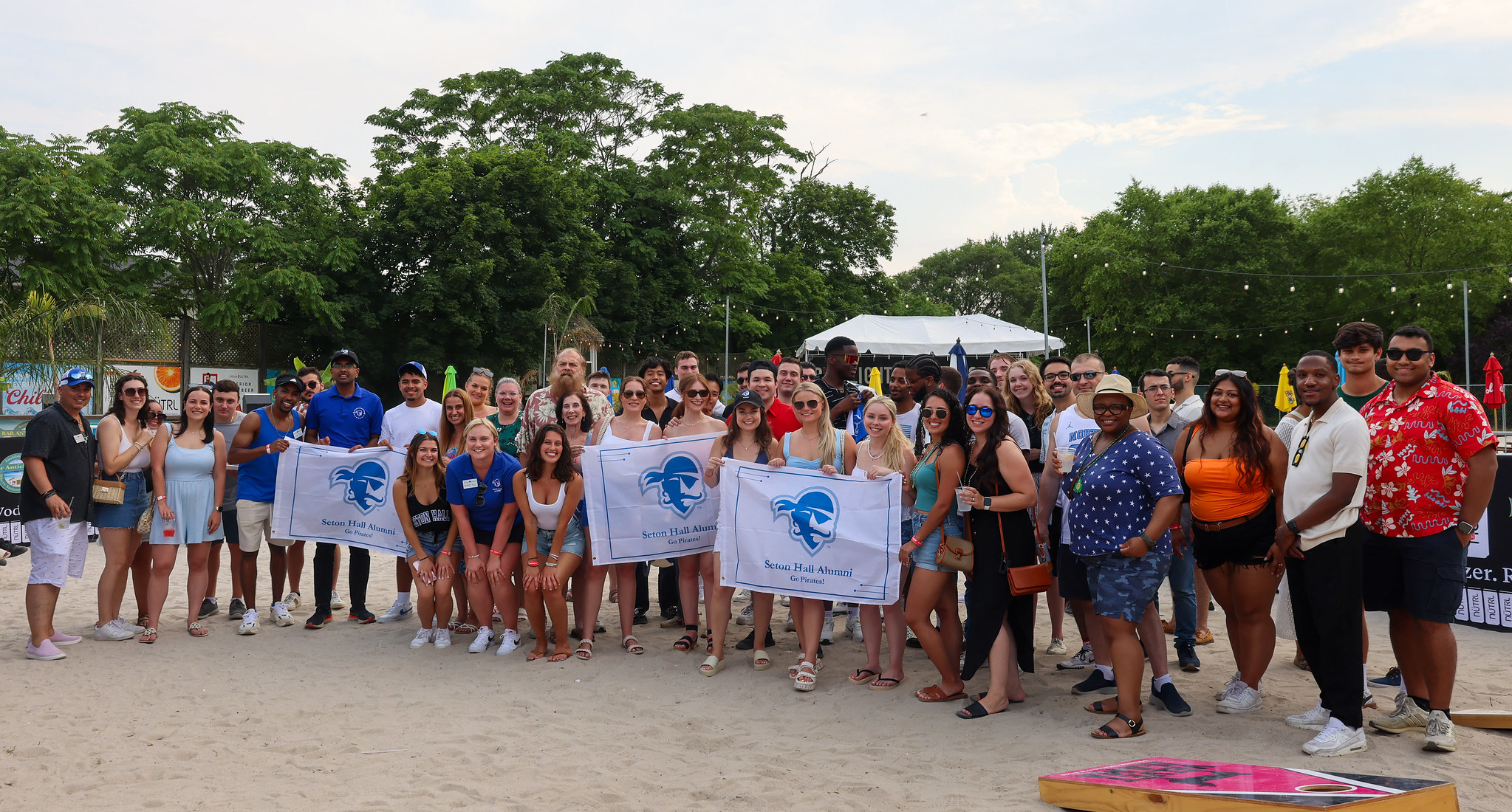 Young alumni posing for a photo at Bar Anticipation