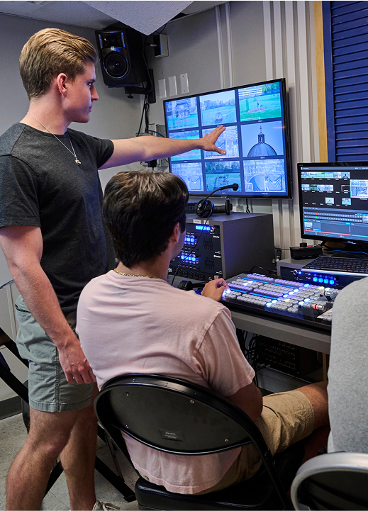 video editng students in a studio