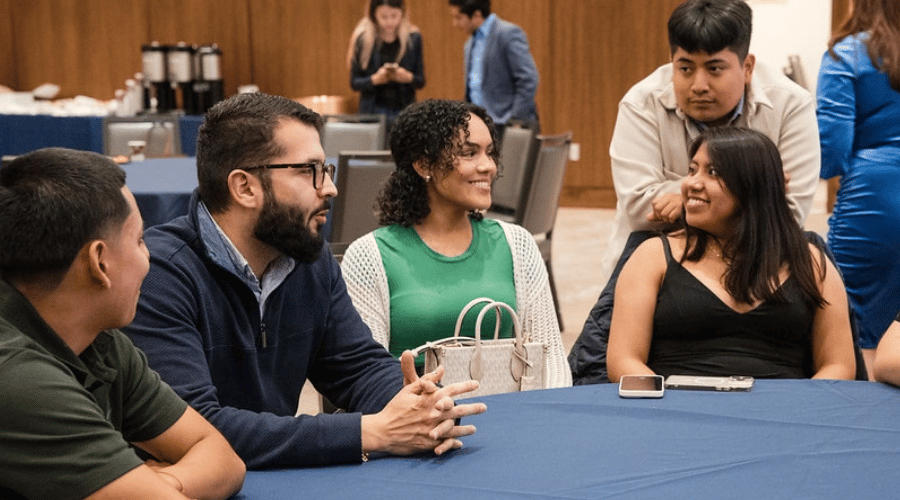 Volunteers networking in Bethany Hall
